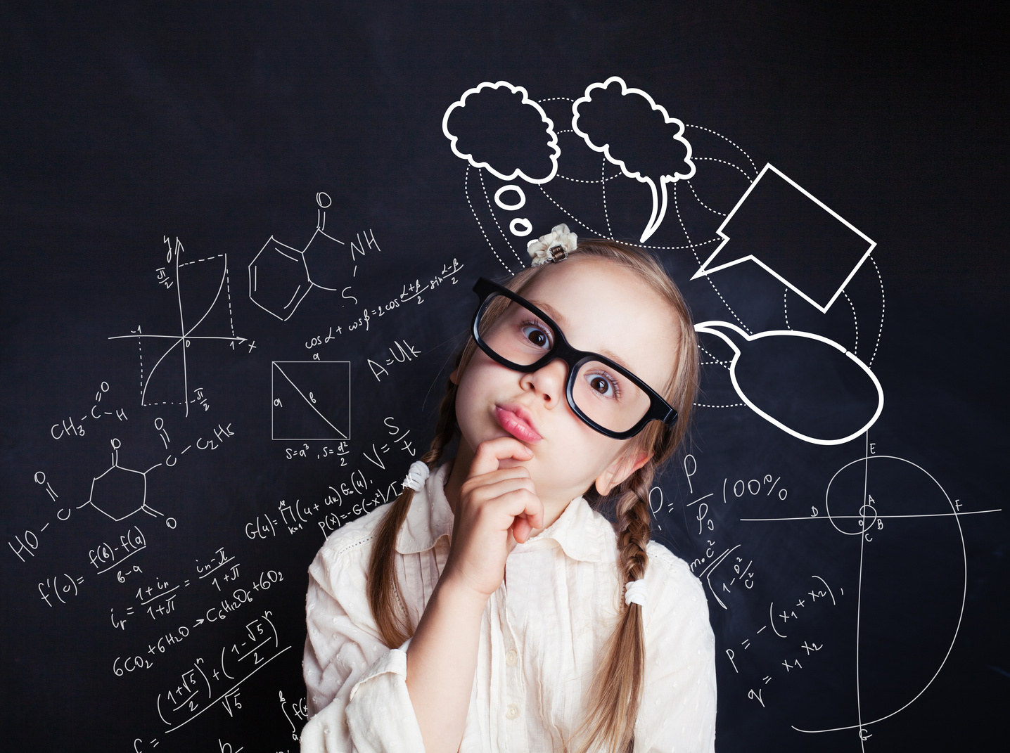 Thinking child with a school blackboard. Kids mathematics concept